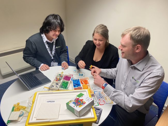 Link ICT specialists Matthew Jackson, Danielle Poulter and Mark Berridge in training to teach the LEGO learning system to schools.